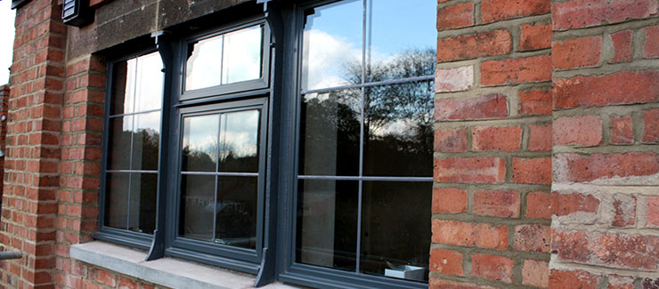 Black aluminium windows with lead detail
