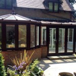 A P shaped conservatory black on the outside and white on the inside