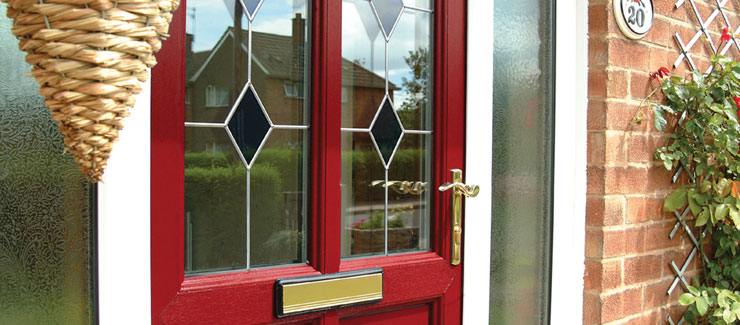 A bright red upvc door with glazed panels