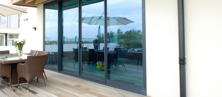 A large smooth sliding patio door in aluminium