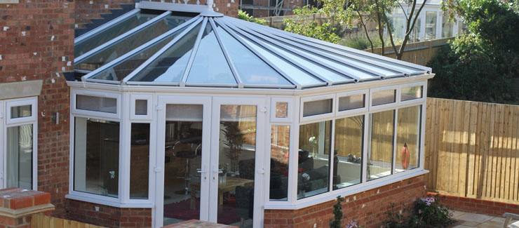 A uPVC conservatory in white with french doors