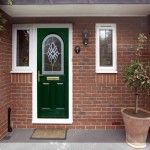 A charming green composite front door